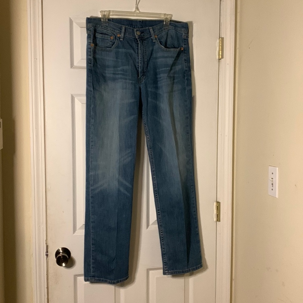 Levi’s 100% cotton blue jeans, lightly distressed, straight-cut, lightly worn